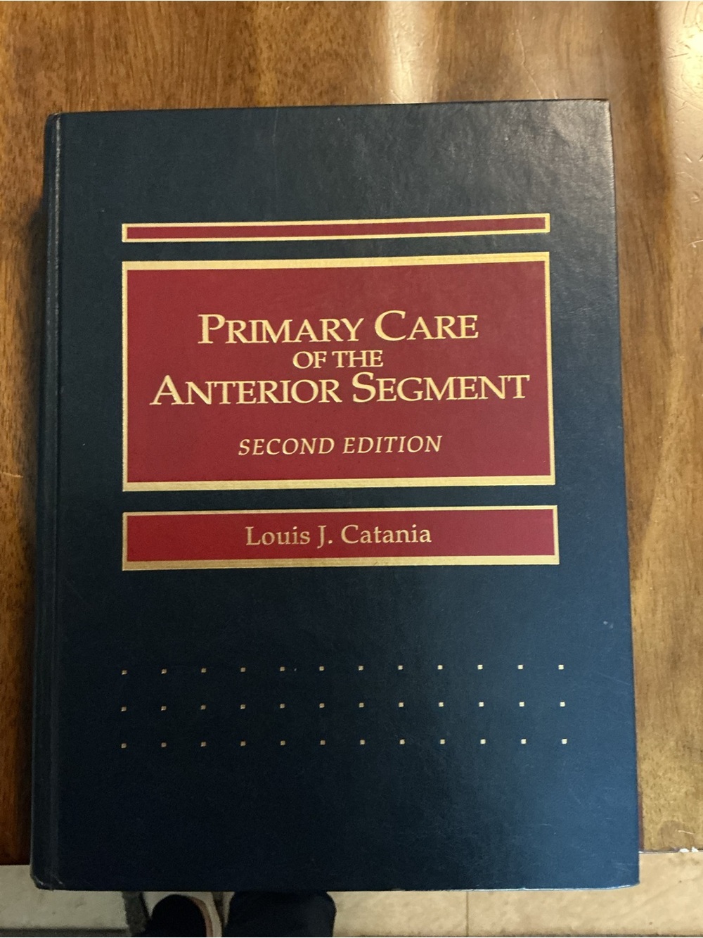 Primary Care of the Anterior Segment - Navy and Red Hardcover Book